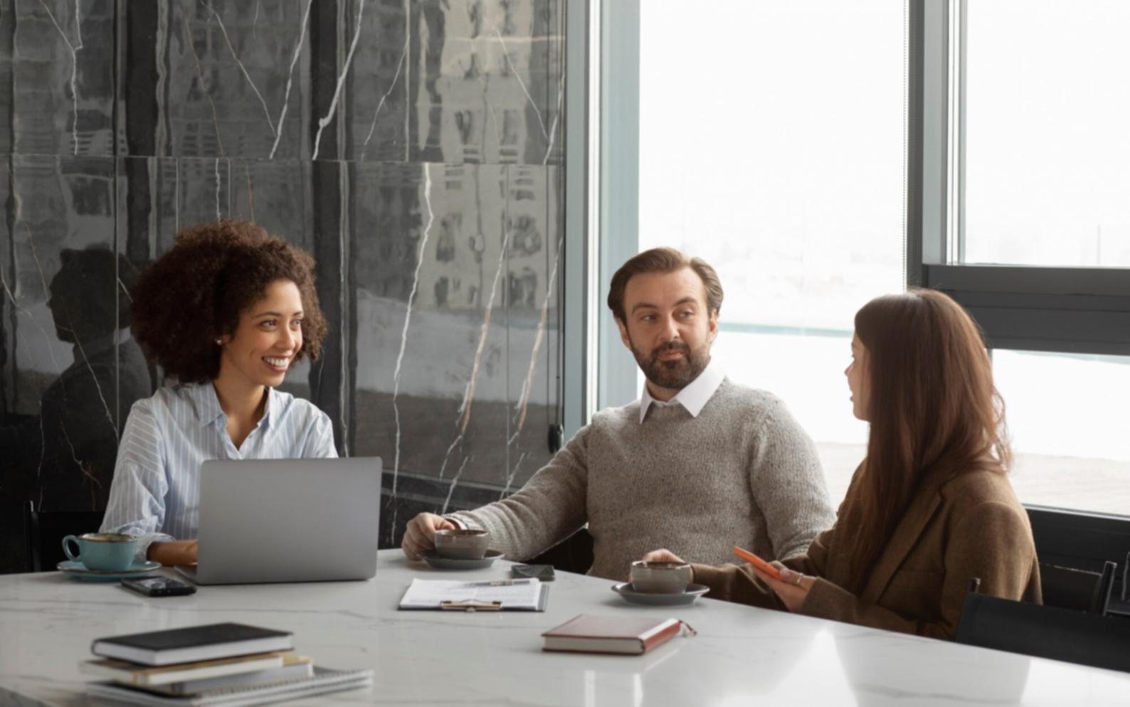 Financial planning documents and investment analysis tools arranged on a professional workspace